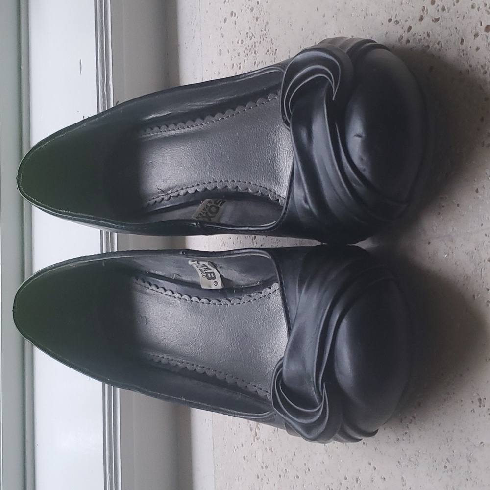 Black business, dress or everyday leather wedge.